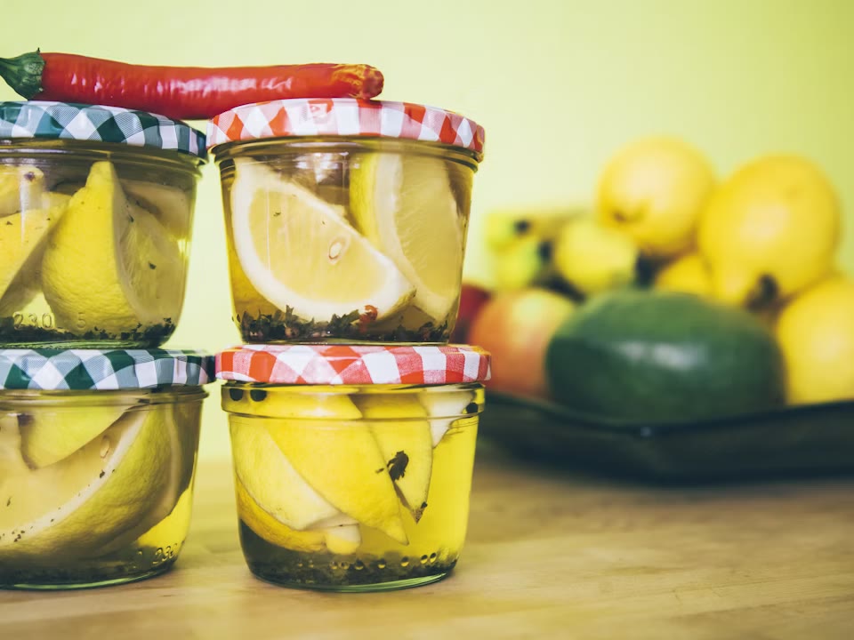 Fermented lemons preserved in glass jars.